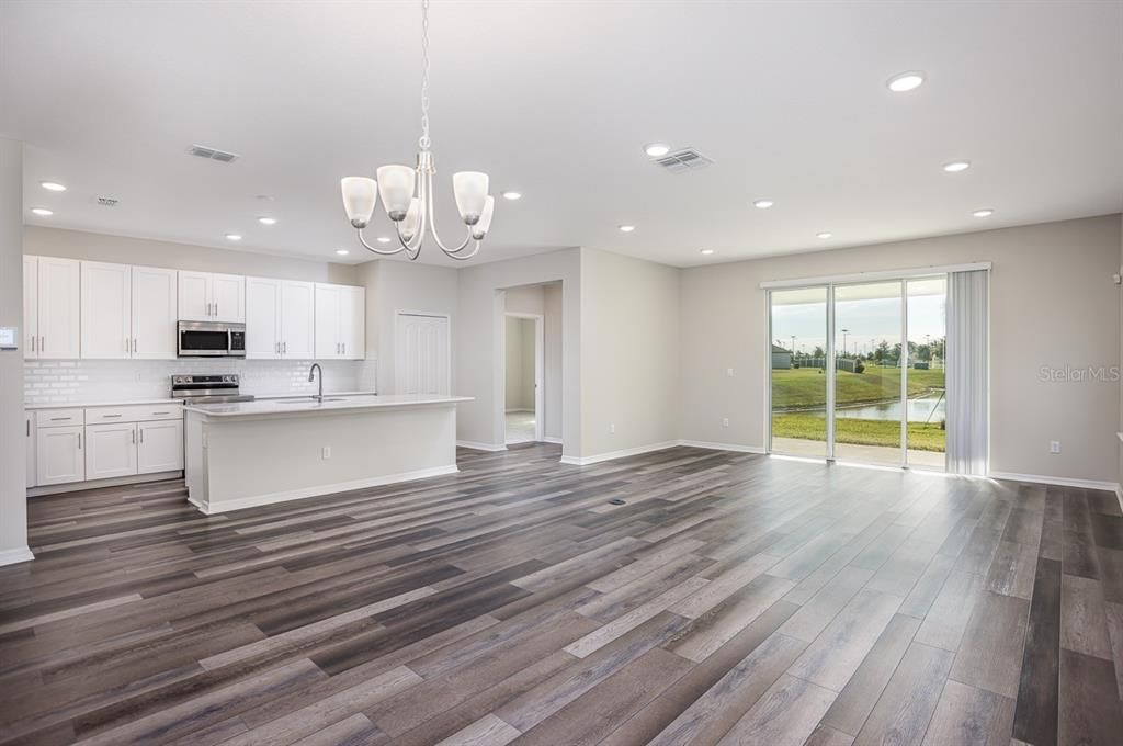 Chandelier, Interior, Kitchen, Recessed Lighting, Stainless Steel Appliances, Wood Texture Flooring
