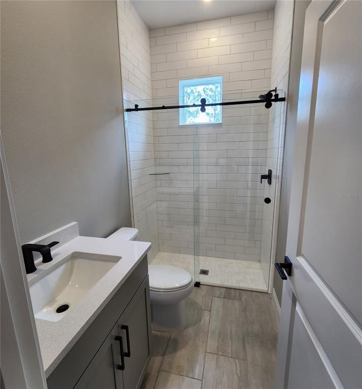 Bathroom, Glass Shower, Interior, Recessed Lighting, Wood Texture Flooring