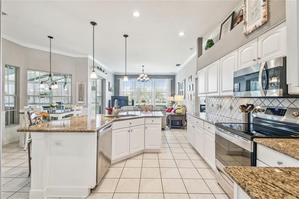Chandelier, Dining room, Interior, Kitchen, Pendant Lights, Recessed Lighting, Stainless Steel Appliances
