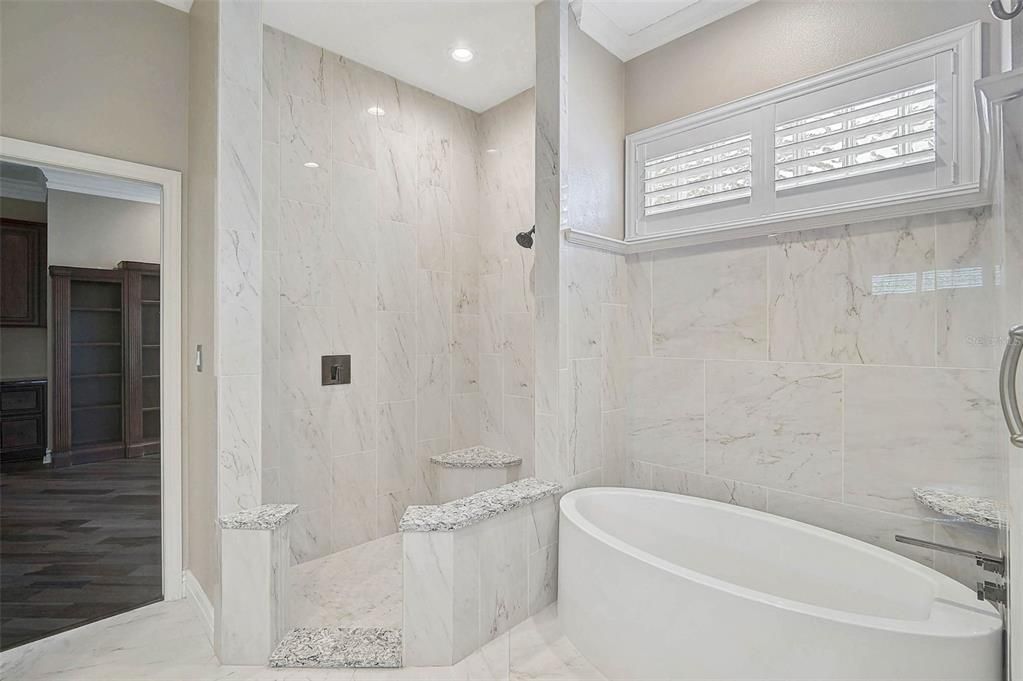 Bathroom, Free Standing Baths, Interior, Marble, Marble Walls, Recessed Lighting, Wood Texture Flooring