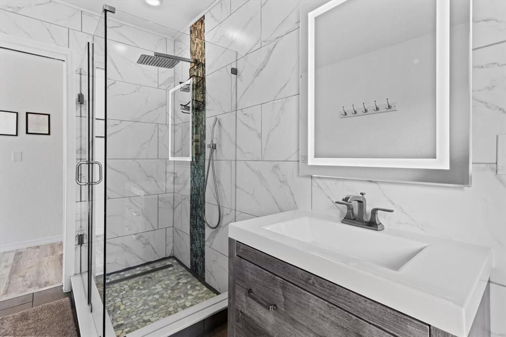 Bathroom, Glass Shower, Interior, Marble Walls, Recessed Lighting, Wood Texture Flooring