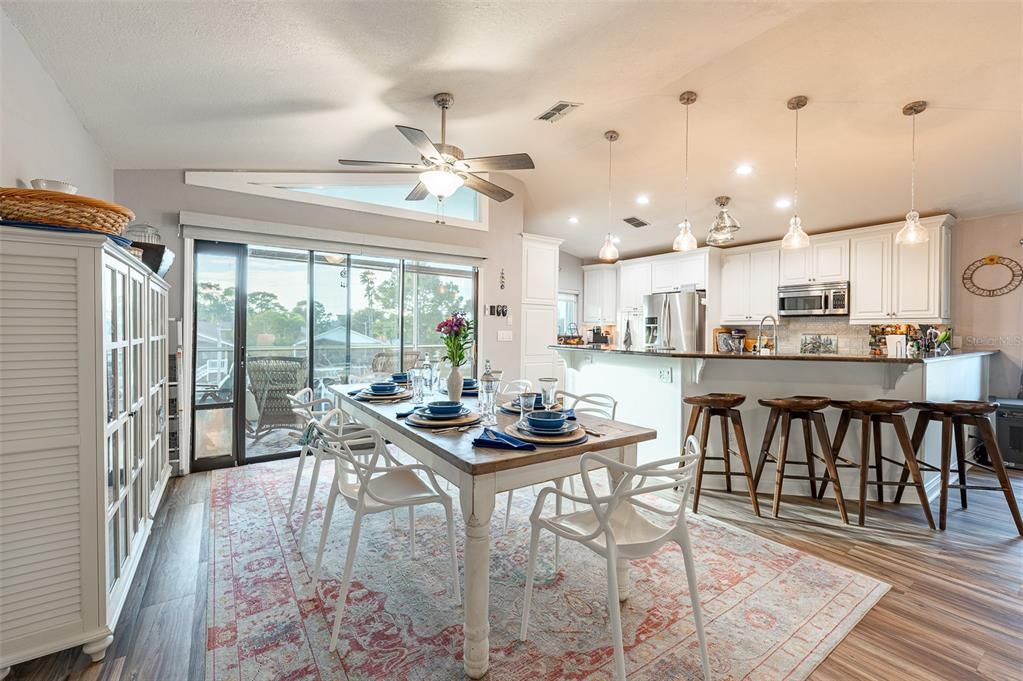 Dining room, Interior, Kitchen, Pendant Lights, Recessed Lighting, Stainless Steel Appliances, Wood Texture Flooring