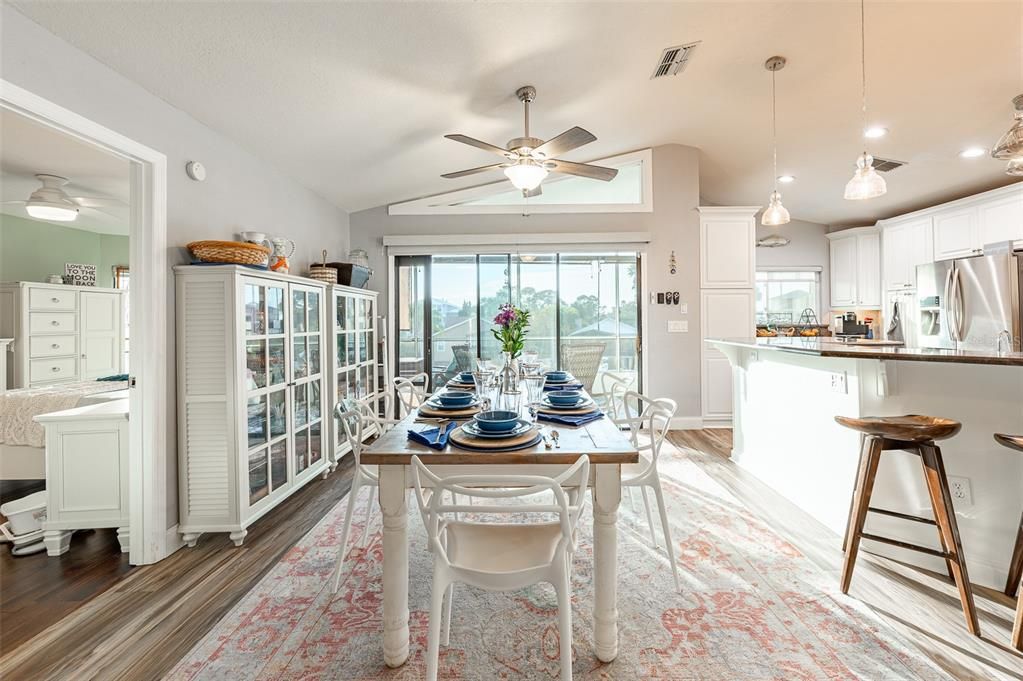 Dining room, Interior, Kitchen, Pendant Lights, Recessed Lighting, Stainless Steel Appliances, Wood Texture Flooring