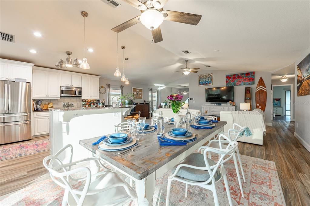 Dining room, Interior, Kitchen, Pendant Lights, Recessed Lighting, Stainless Steel Appliances, Wood Texture Flooring