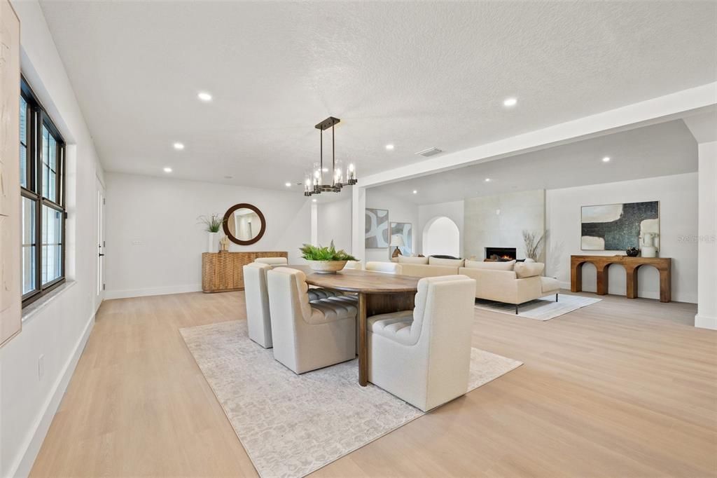 Dining room, Fireplace, Interior, Living room, Pendant Lights, Recessed Lighting, Wood Texture Flooring