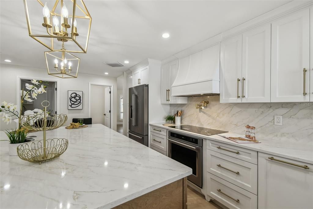 Interior, Kitchen, Marble Walls, Pendant Lights, Recessed Lighting, Stainless Steel Appliances