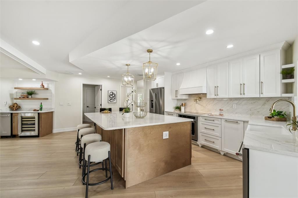 Interior, Kitchen, Marble Walls, Pendant Lights, Recessed Lighting, Stainless Steel Appliances, Wood Texture Flooring