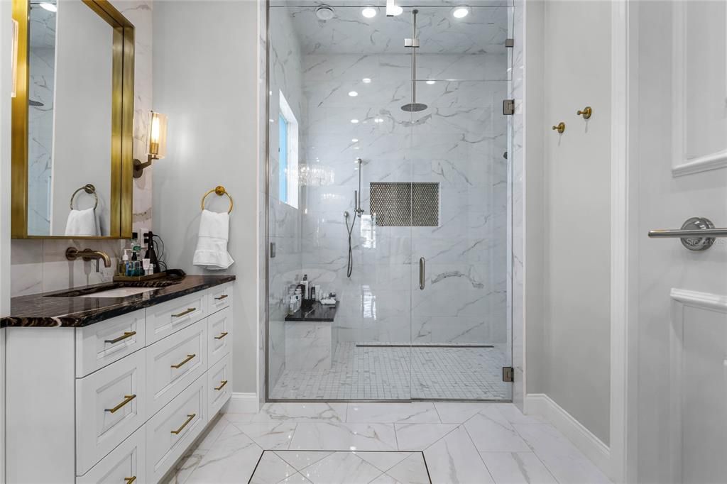 Bathroom, Dual Sink Vanities, Glass Shower, Interior, Marble, Marble Walls, Recessed Lighting