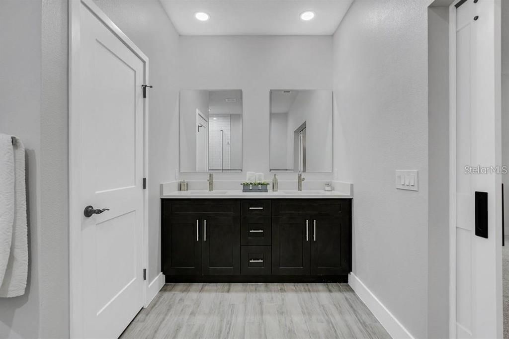 Bathroom, Dual Sink Vanities, Interior, Recessed Lighting, Wood Texture Flooring
