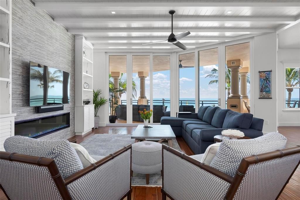Fireplace, Interior, Living room, Recessed Lighting, Stone Walls, Water, Wood Texture Flooring