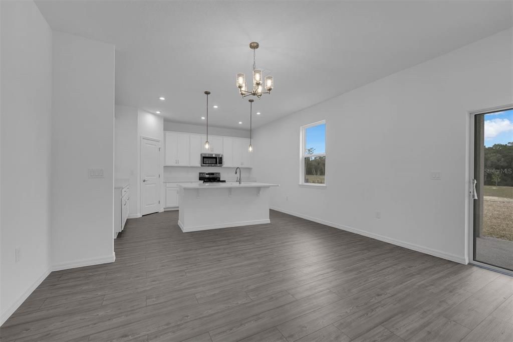 Chandelier, Interior, Kitchen, Pendant Lights, Recessed Lighting, Stainless Steel Appliances, Wood Texture Flooring