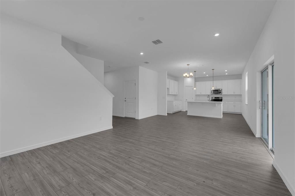 Chandelier, Interior, Kitchen, Recessed Lighting, Stainless Steel Appliances, Wood Texture Flooring