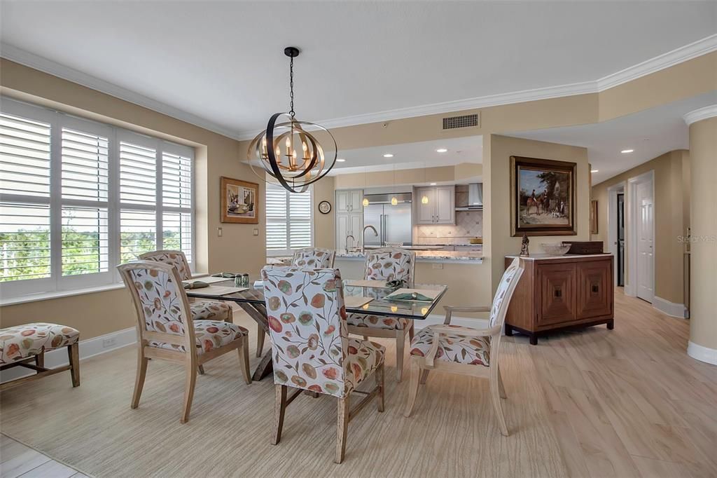 Chandelier, Dining room, Interior, Kitchen, Pendant Lights, Recessed Lighting, Stainless Steel Appliances, Wood Texture Flooring