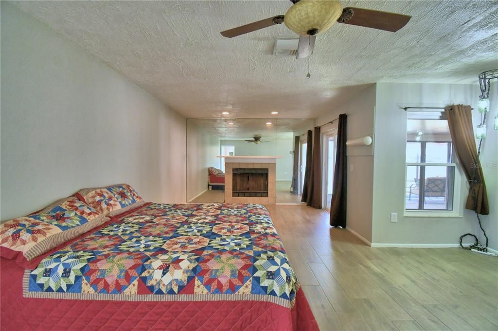 Bedroom, Fireplace, Interior, Recessed Lighting, Wood Texture Flooring