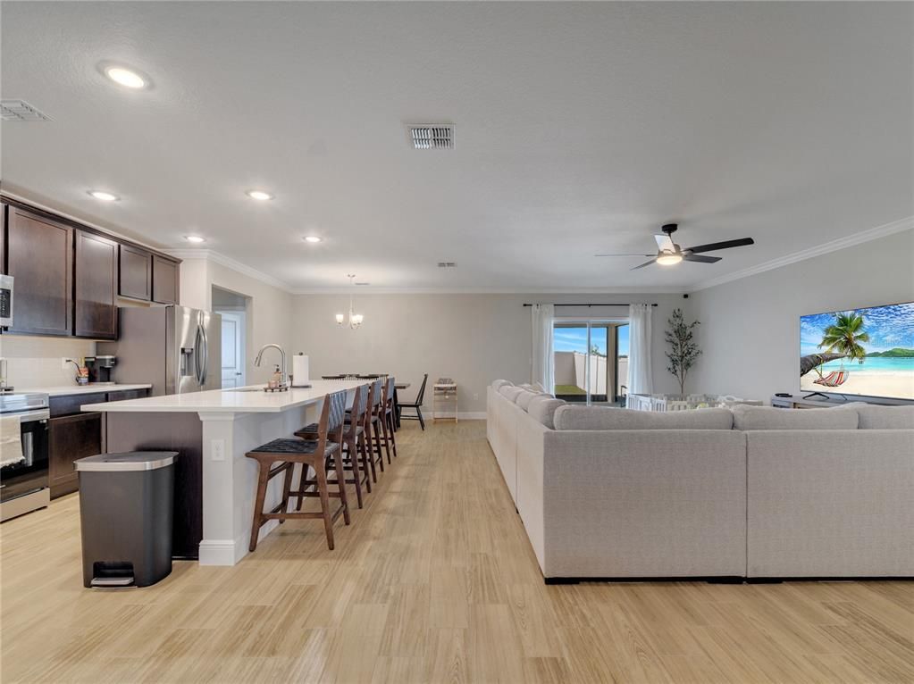 Dining room, Interior, Kitchen, Living room, Pendant Lights, Recessed Lighting, Stainless Steel Appliances, Wood Texture Flooring