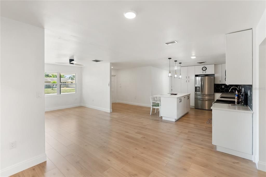 Dining room, Interior, Kitchen, Pendant Lights, Recessed Lighting, Stainless Steel Appliances, Wood Texture Flooring