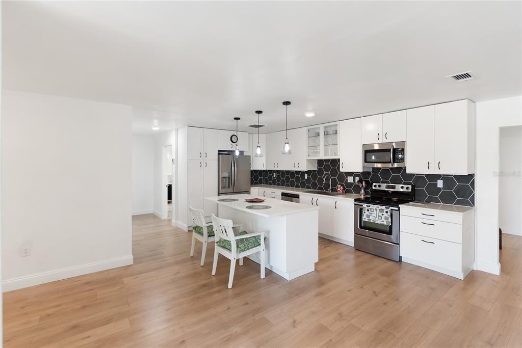 Dining room, Interior, Kitchen, Pendant Lights, Stainless Steel Appliances, Wood Texture Flooring