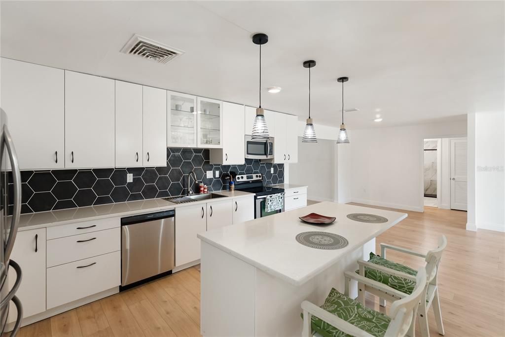 Interior, Kitchen, Pendant Lights, Recessed Lighting, Stainless Steel Appliances, Wood Texture Flooring