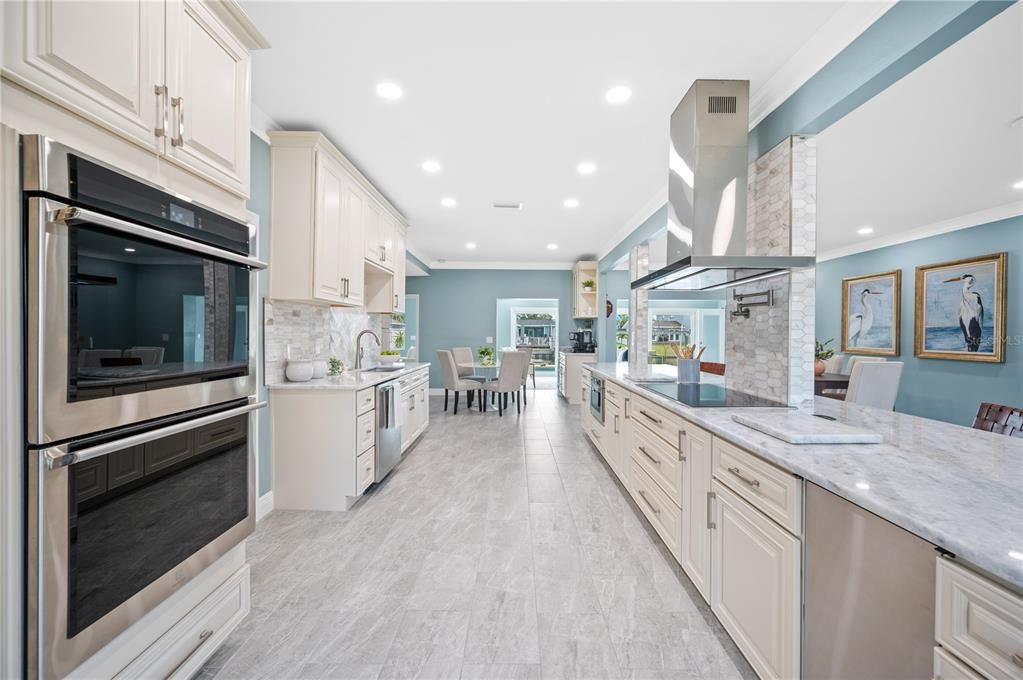 Dining room, Interior, Kitchen, Recessed Lighting, Stainless Steel Appliances, Wood Texture Flooring