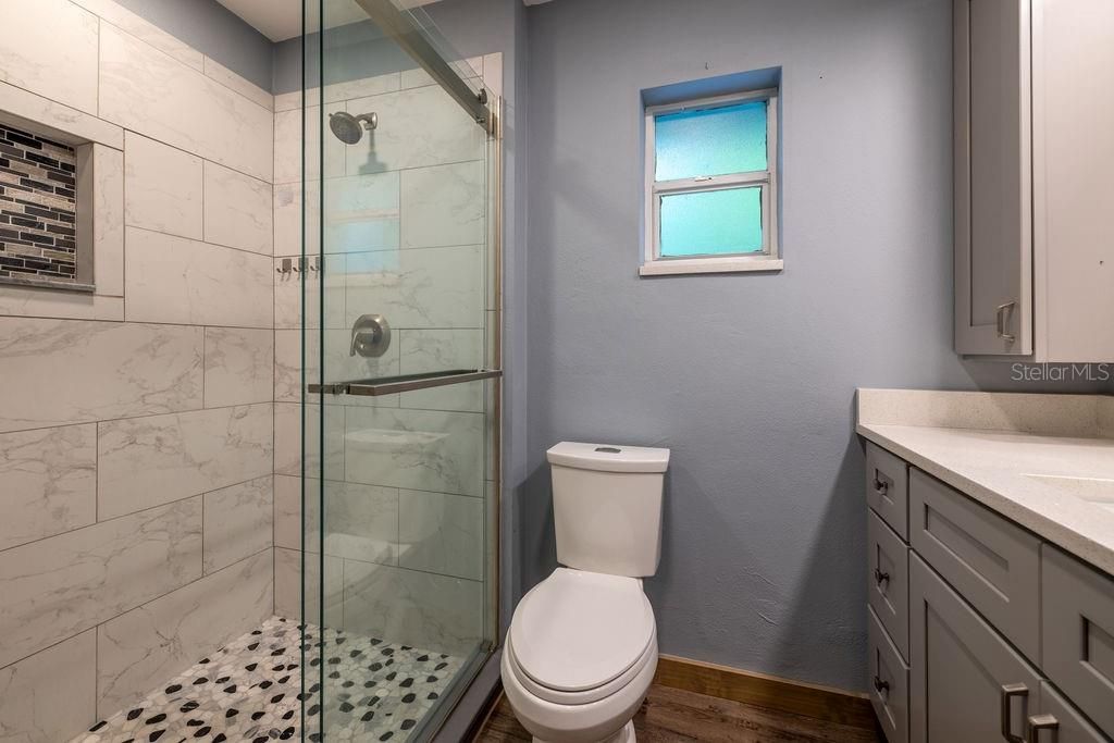 Bathroom, Glass Shower, Interior, Marble Walls, Wood Texture Flooring
