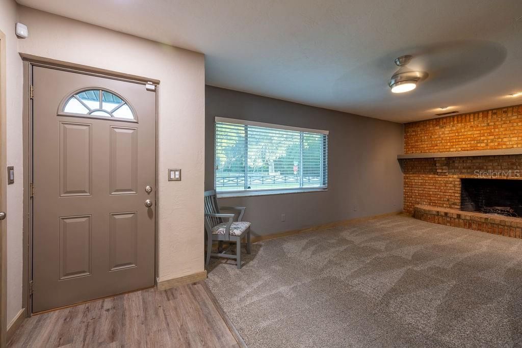 Empty room, Fireplace, Interior, Recessed Lighting, Stone Walls, Wood Texture Flooring