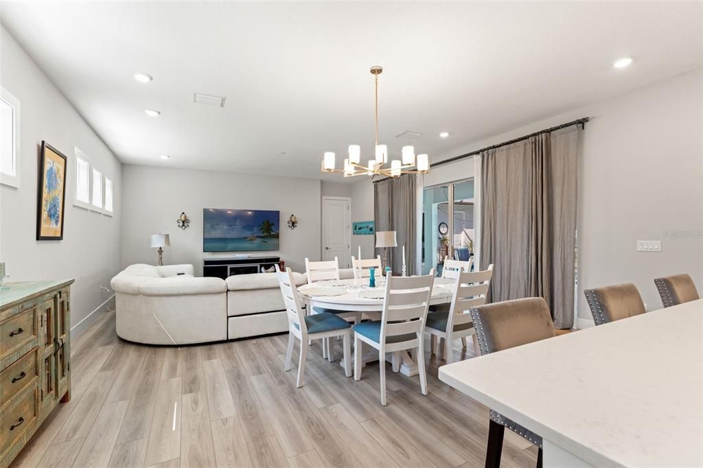 Chandelier, Dining room, Interior, Living room, Pendant Lights, Recessed Lighting, Wood Texture Flooring