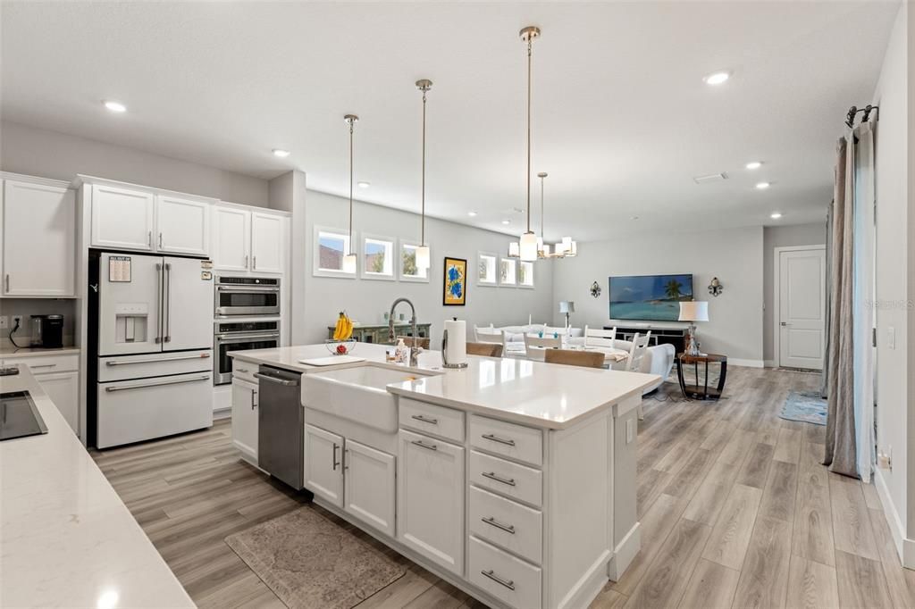 Dining room, Interior, Kitchen, Pendant Lights, Recessed Lighting, Stainless Steel Appliances, Wood Texture Flooring