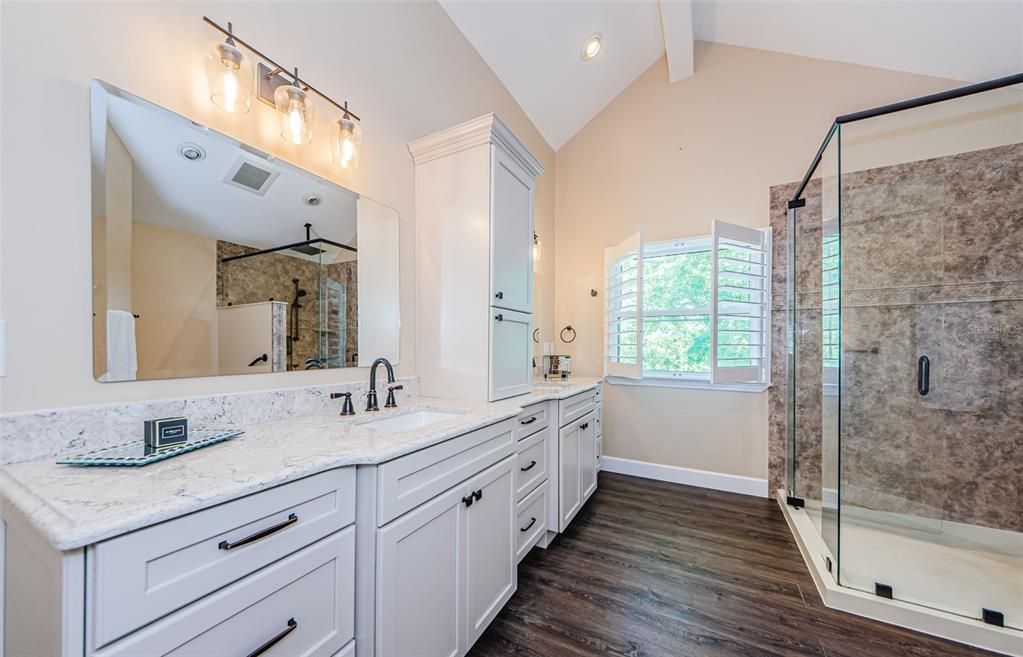 Bathroom, Dual Sink Vanities, Glass Shower, Interior, Recessed Lighting, Wood Texture Flooring