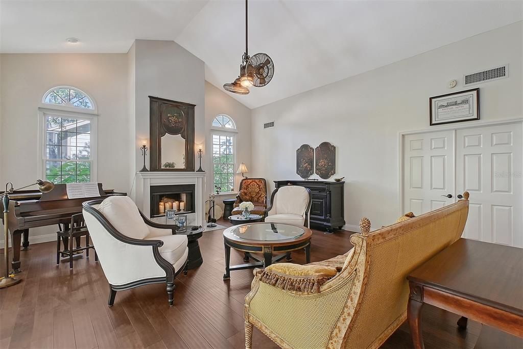 Fireplace, Interior, Living room, Pendant Lights, Piano, Recessed Lighting, Wood Texture Flooring