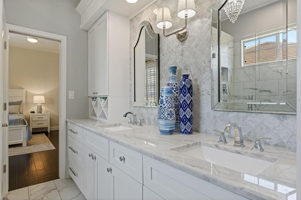 Bathroom, Dual Sink Vanities, Interior, Marble, Marble Walls, Recessed Lighting, Wood Texture Flooring