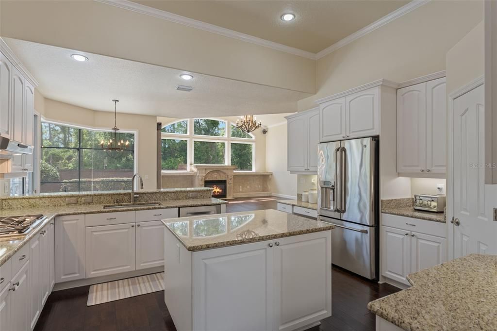 Chandelier, Fireplace, Interior, Kitchen, Pendant Lights, Recessed Lighting, Wood Texture Flooring