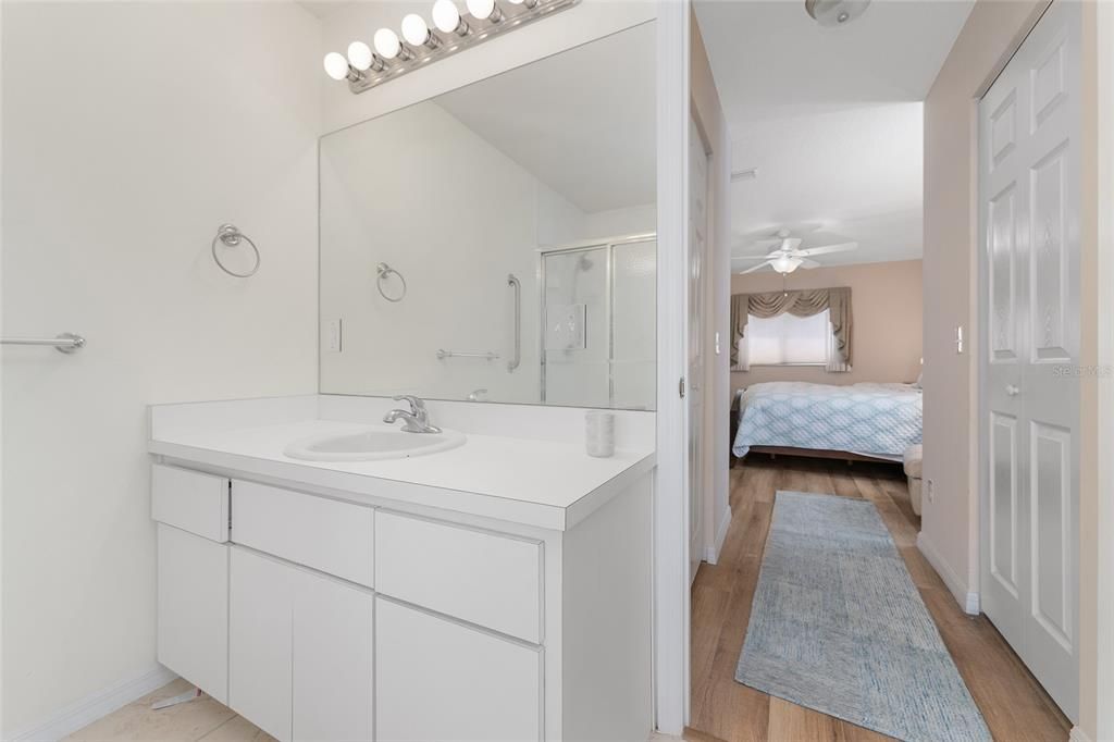 Bathroom, Bedroom, Dual Sink Vanities, Glass Shower, Interior, Wood Texture Flooring