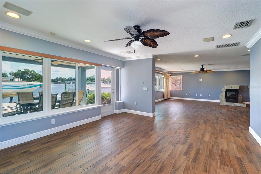 Empty room, Fireplace, Interior, Recessed Lighting, Water, Wood Texture Flooring