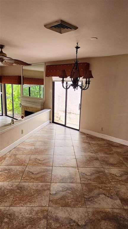 Chandelier, Empty room, Fireplace, Interior