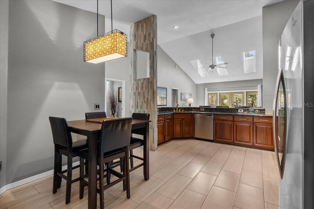 Dining room, Interior, Kitchen, Pendant Lights, Recessed Lighting, Stainless Steel Appliances, Wood Texture Flooring