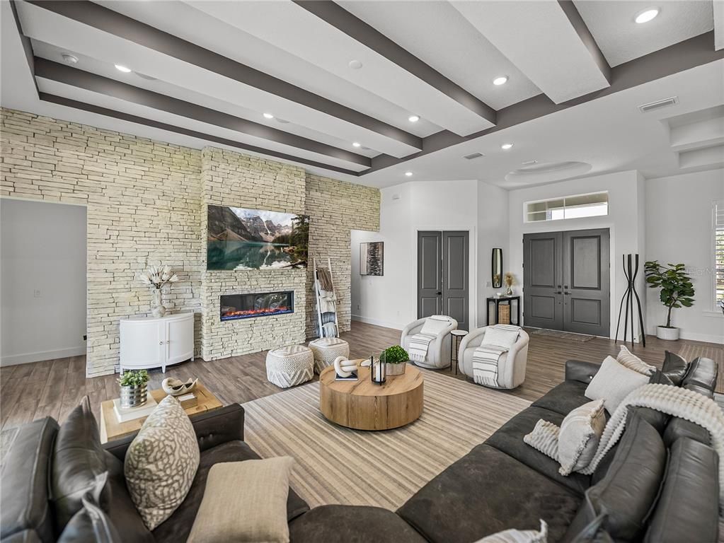Fireplace, Interior, Living room, Recessed Lighting, Stone Walls, Wood Texture Flooring