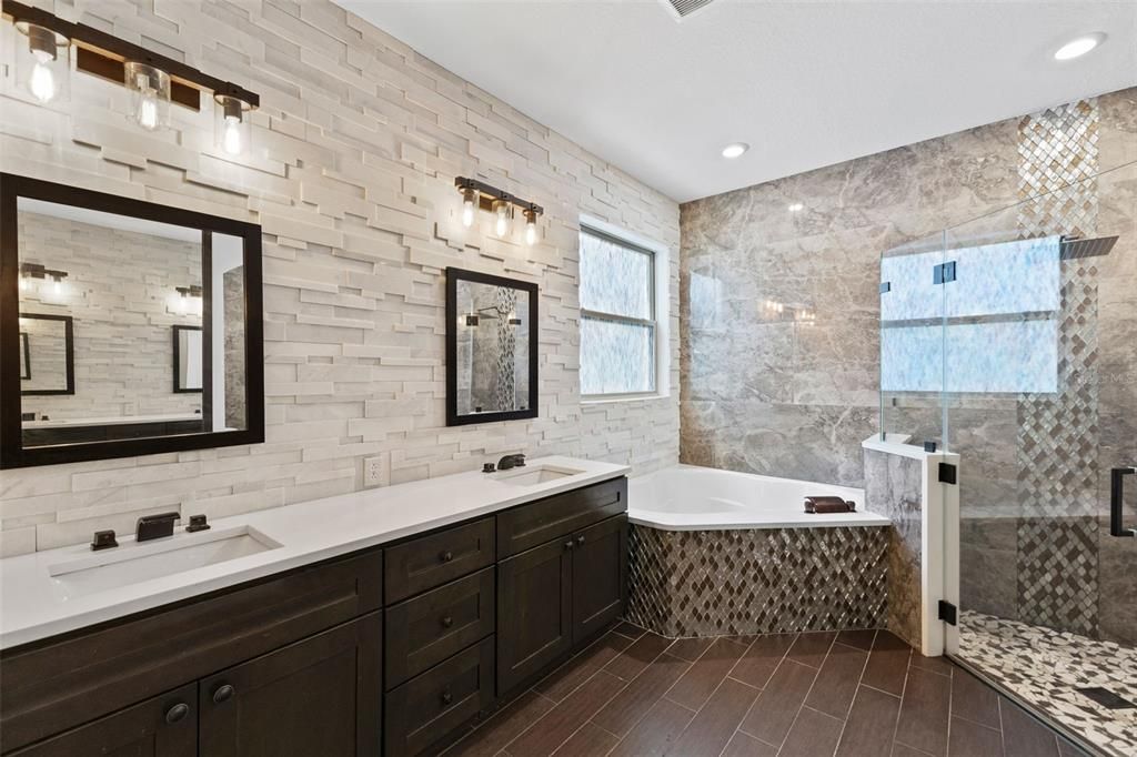 Bathroom, Dual Sink Vanities, Glass Shower, Interior, Recessed Lighting, Stone Walls, Wood Texture Flooring