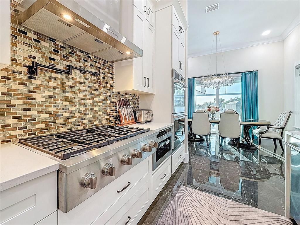Dining room, Interior, Kitchen, Pendant Lights, Recessed Lighting, Stainless Steel Appliances, Stone Walls