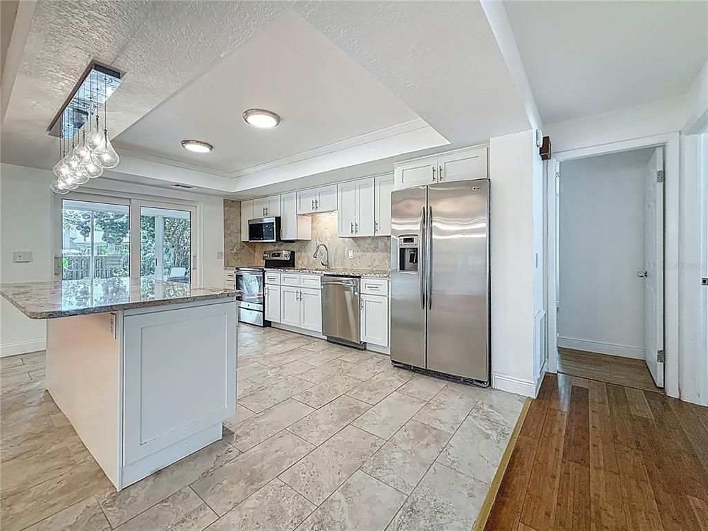 Interior, Kitchen, Pendant Lights, Recessed Lighting, Stainless Steel Appliances, Wood Texture Flooring