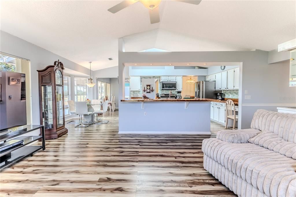 Dining room, Interior, Kitchen, Pendant Lights, Recessed Lighting, Stainless Steel Appliances, Wood Texture Flooring