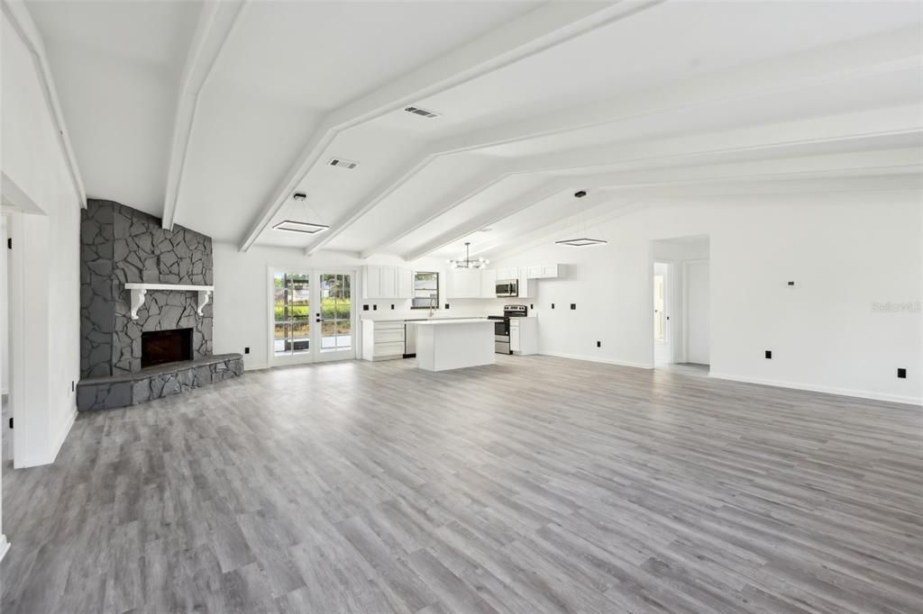 Empty room, Fireplace, Interior, Kitchen, Pendant Lights, Wood Texture Flooring