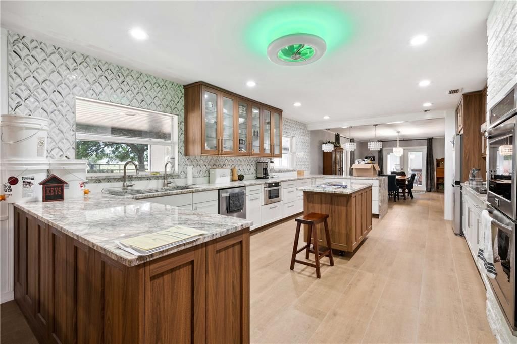 Dining room, Interior, Kitchen, Pendant Lights, Recessed Lighting, Stainless Steel Appliances, Wood Texture Flooring