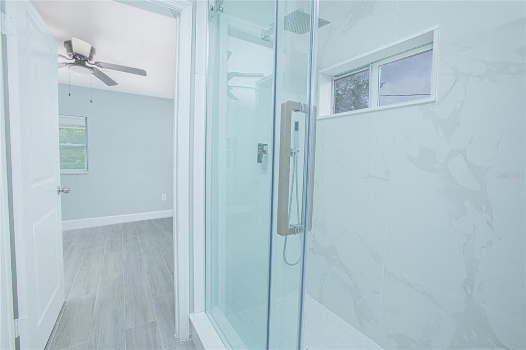 Bathroom, Glass Shower, Interior, Marble Walls, Wood Texture Flooring