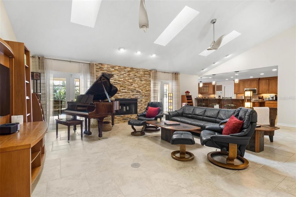 Fireplace, Interior, Kitchen, Living room, Piano, Recessed Lighting, Stone Walls