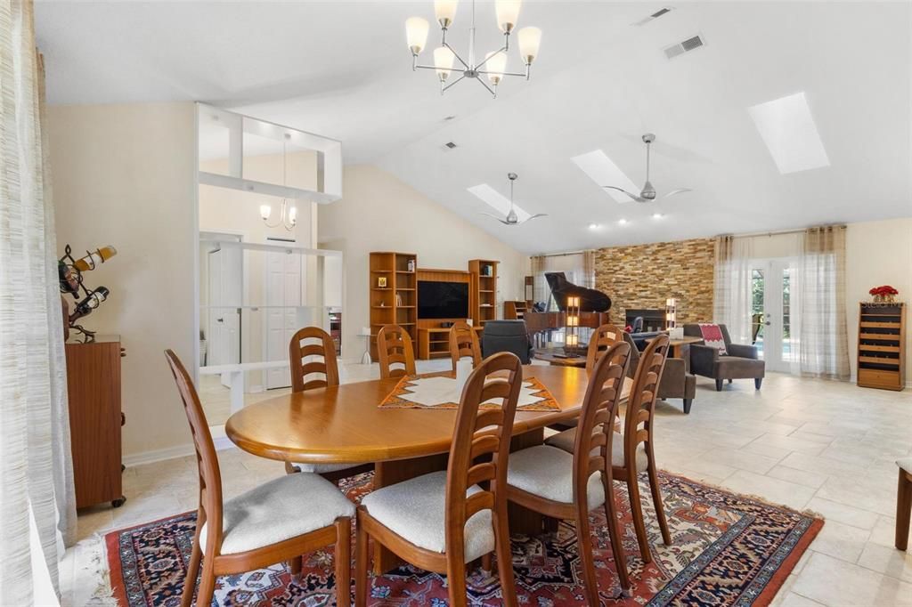 Chandelier, Dining room, Fireplace, Interior, Living room, Recessed Lighting, Stone Walls