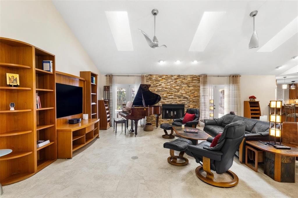 Fireplace, Interior, Living room, Pendant Lights, Piano, Recessed Lighting, Stone Walls