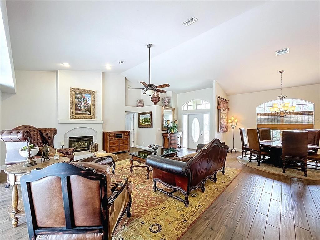 Chandelier, Dining room, Fireplace, Interior, Living room, Recessed Lighting, Wood Texture Flooring