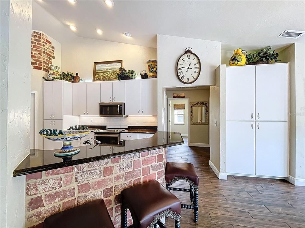 Interior, Kitchen, Recessed Lighting, Stainless Steel Appliances, Stone Walls, Wood Texture Flooring