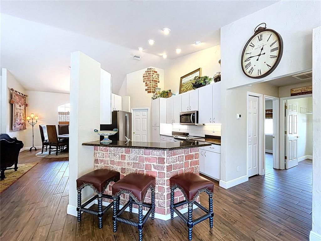 Dining room, Interior, Kitchen, Recessed Lighting, Stainless Steel Appliances, Wood Texture Flooring