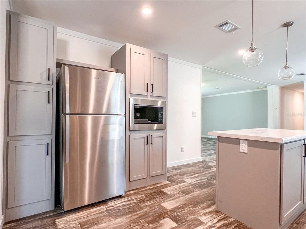 Interior, Kitchen, Pendant Lights, Recessed Lighting, Stainless Steel Appliances, Wood Texture Flooring